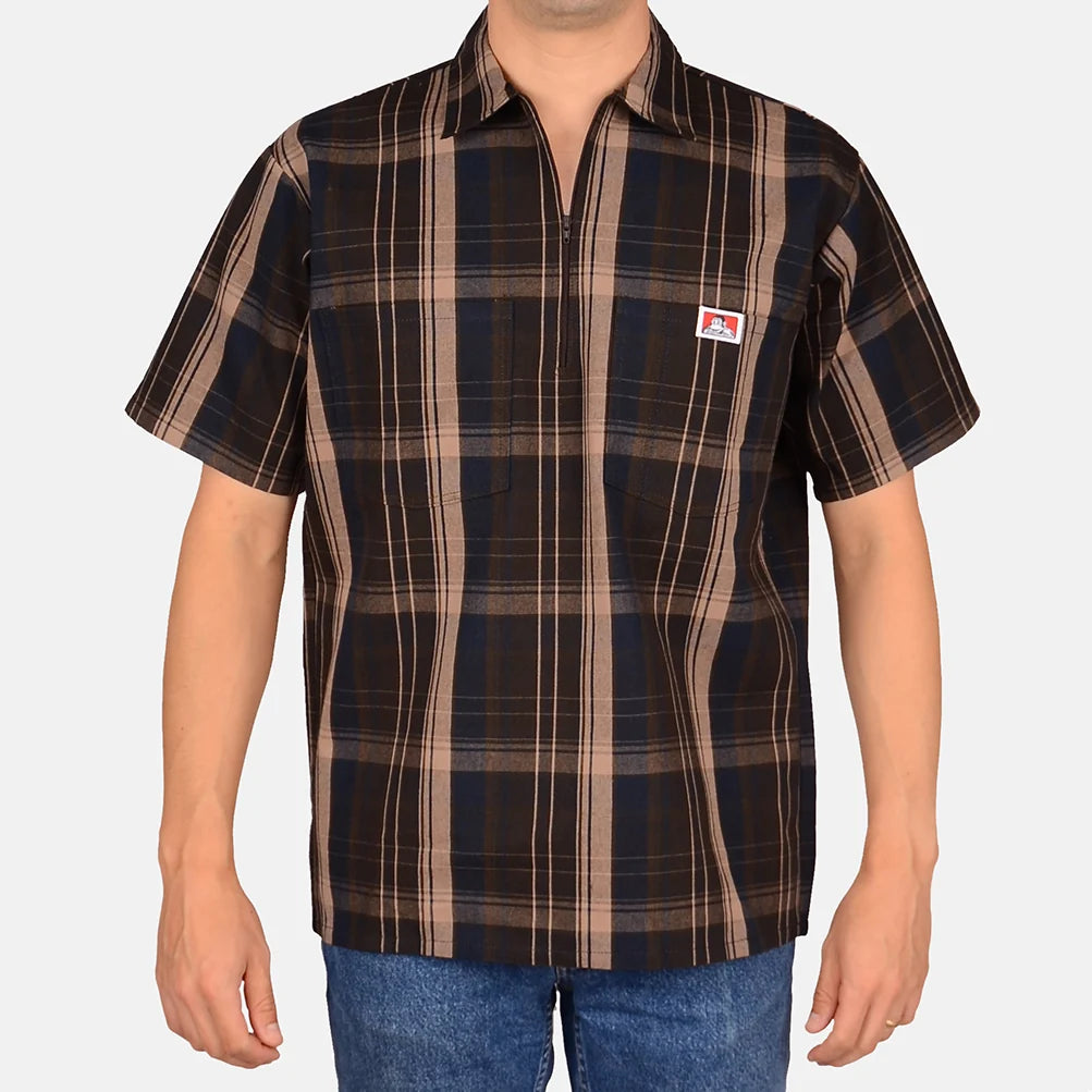 Model wearing a Ben Davis brown plaid short-sleeve half-zip shirt with chest logo front view