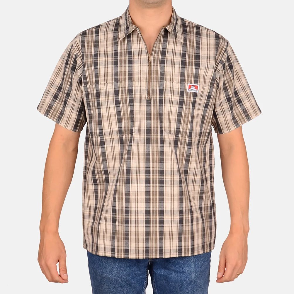 Model wearing a Ben Davis khaki grey plaid short-sleeve half-zip shirt with chest logo front view