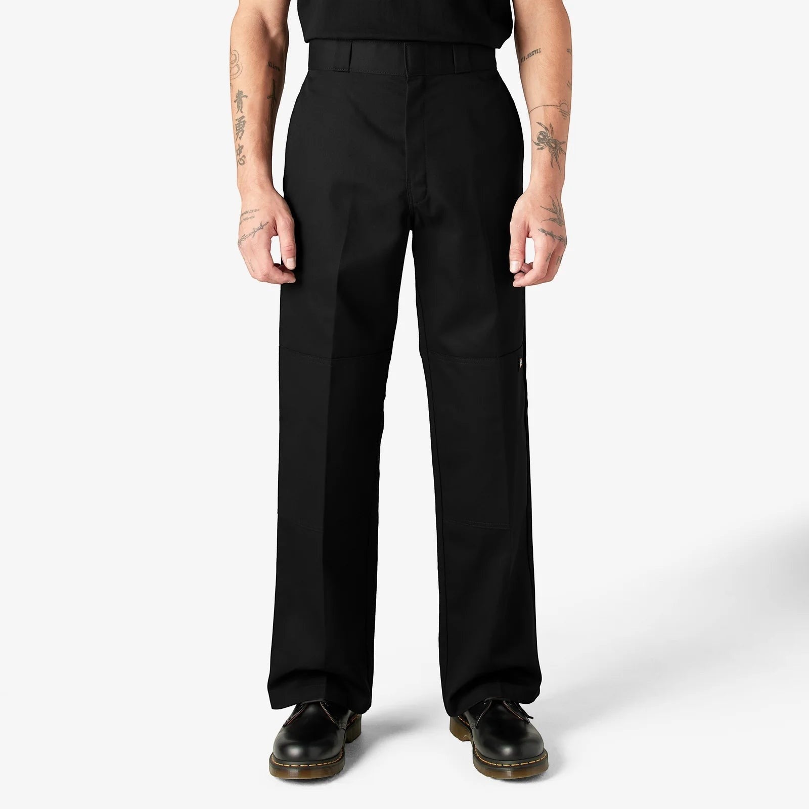 City Of Saints Clothing Dickies loose fit black work pants with reinforced double-knee panels worn by a model.
